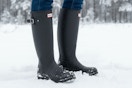 women wearing hunter boots in the snow 