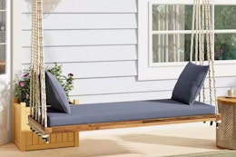 Lifestyle image of the Harper & Brights Swing Bench in front porch setting