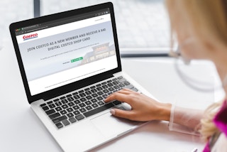 someone looking at the teacher discount card offer on the costco website