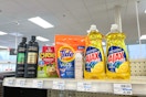 tresemme shampoo, chewy granola bars, tide pods, nexxus dry shampoo, and ajax dish soap on a shelf