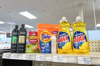 tresemme shampoo, chewy granola bars, tide pods, nexxus dry shampoo, and ajax dish soap on a shelf