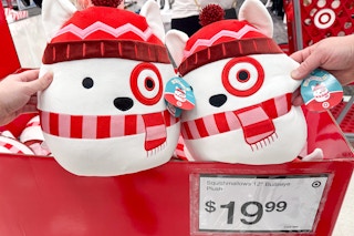 two hands grabbing two target bullseye squishmallows
