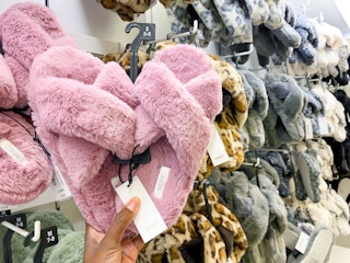 hand holding plush slippers