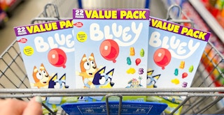 Boxes of Bluey fruit snacks in a cart at Walmart