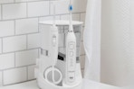 lifestyle image of a waterpik on a counter