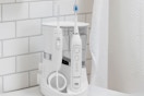 lifestyle image of a waterpik on a counter