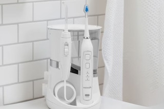 lifestyle image of a waterpik on a counter