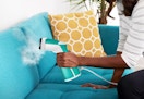 hand holding a sunbeam handheld steamer 