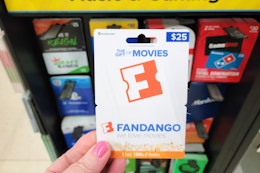hand holding a fandango gift card