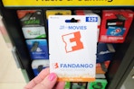 hand holding a fandango gift card
