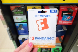 hand holding a fandango gift card