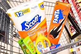 scott toilet paper, fanta soda, garnier shampoo, tide simply, and food storage bags in a cart