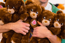 an arm full of build a bear lil cubs for national hug day