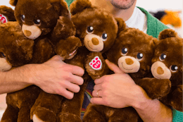 an arm full of build a bear lil cubs for national hug day