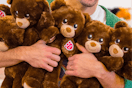 an arm full of build a bear lil cubs for national hug day