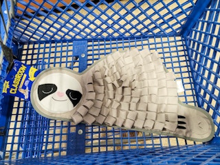 sloth snuffle mat in a cart