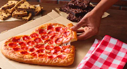 Pizza hut Valentines heart pizza with brownie and cookie slices in the background