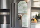 weekly calendar dry erase board set on a refrigerator 