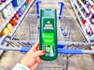 hand holding a bottle of irish-spring-body-wash in front of walmart cart