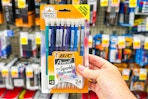hand holding a pack of bic mechanical pencils