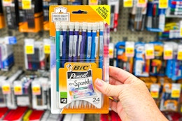 hand holding a pack of bic mechanical pencils