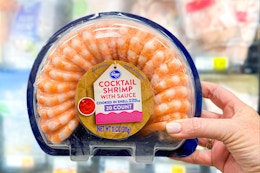 hand holding a kroger shrimp platter