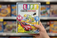 hand holding game of life walgreens