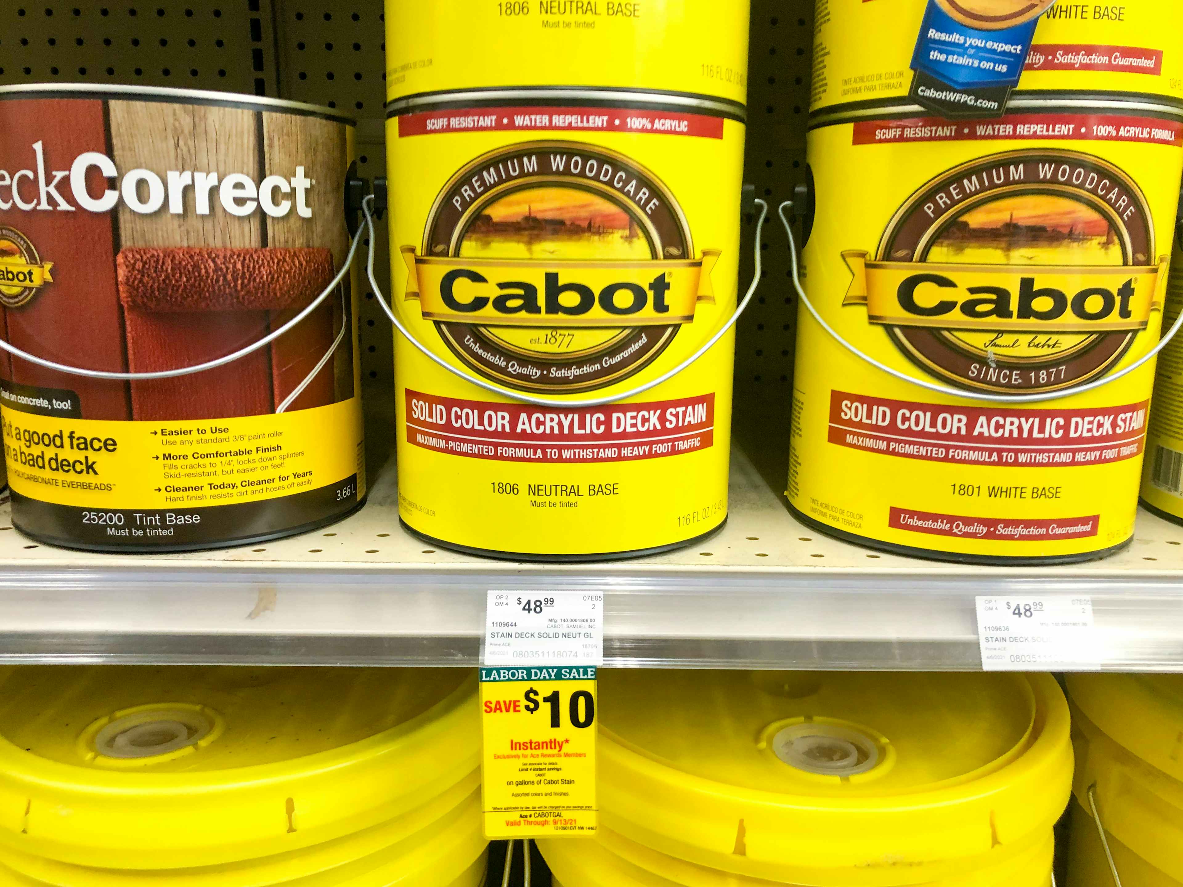 cabot acrylic deck stain gallons on the shelf at ace hardware with a labor day sale sticker