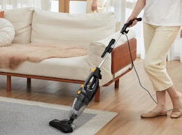 a person vacuuming a room 