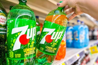 hand grabbing a bottle of 7up