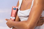 Woman holding Vaseline Serum Burst Lotion