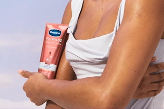 Woman holding Vaseline Serum Burst Lotion