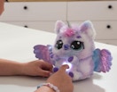 a stuffed unicorn with a light on its belly 