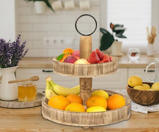 2-Tier wooden tray with fruit on a kitchen counter