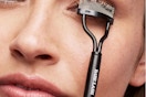 lifestyle image of person using an eyelash separator