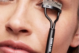 lifestyle image of person using an eyelash separator