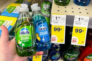 hand holding two bottles of dawn dish soap in front of store shelf