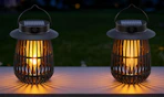 two solar lanterns on a table