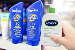 hand holding cetaphil with coppertone