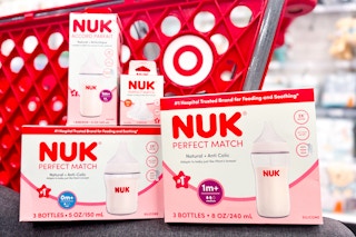 nuk perfect match baby bottle products in front of a Target cart