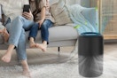 a family sitting near an air purifier