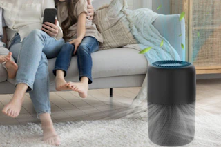a family sitting near an air purifier