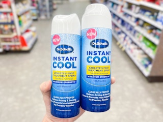 hand holding dr scholls