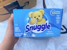 Person holding dryer sheets by Prime packaging