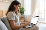 a woman using opinion outpost on her laptop