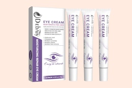 three tubes of eye cream next to a box