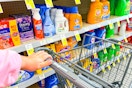hand pushing a cart in the laundry aisle