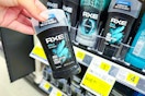 hand holding axe deodorant at dollar general