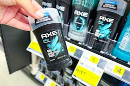 hand holding axe deodorant at dollar general