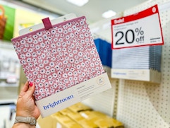 hand holding a brightroom storage cube bin in front of a target shelf